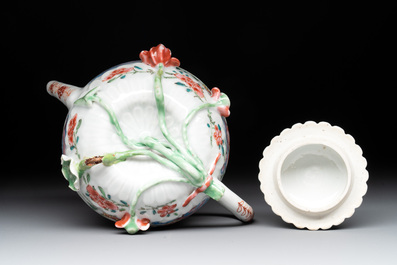 A Chinese famille rose 'rooster' teapot with applied floral design, two cups and a saucer, Yongzheng/Qianlong