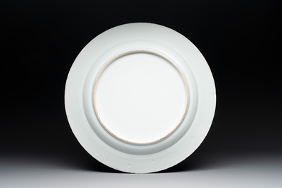 A Chinese blue and white armorial 'Marchant and Gallart accoll&eacute;' dish for the Dutch market, Qianlong