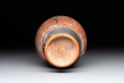 A Greek terracotta 'Oenochoe' vase with Hephaestus and Silenus, Roman era