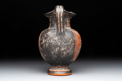 A Greek terracotta 'Oenochoe' vase with Hephaestus and Silenus, Roman era