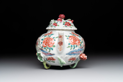 A Chinese famille rose 'rooster' teapot with applied floral design, two cups and a saucer, Yongzheng/Qianlong