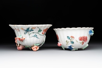 A Chinese famille rose 'rooster' teapot with applied floral design, two cups and a saucer, Yongzheng/Qianlong