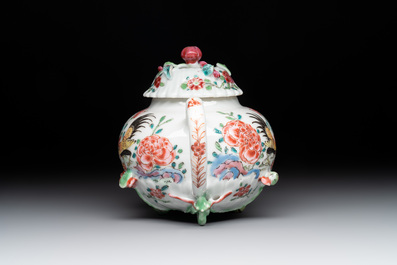 A Chinese famille rose 'rooster' teapot with applied floral design, two cups and a saucer, Yongzheng/Qianlong