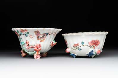 A Chinese famille rose 'rooster' teapot with applied floral design, two cups and a saucer, Yongzheng/Qianlong