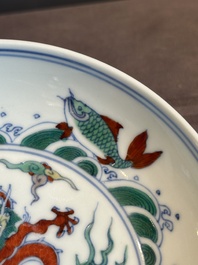 A Chinese doucai 'dragon and carps' plate, Chenghua mark, Yongzheng