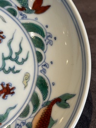 A Chinese doucai 'dragon and carps' plate, Chenghua mark, Yongzheng