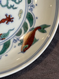 A Chinese doucai 'dragon and carps' plate, Chenghua mark, Yongzheng