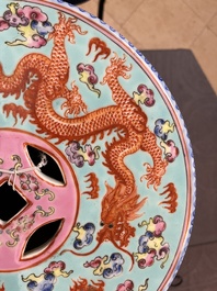 A pair of Chinese famille rose turquoise-ground 'dragon' garden seats, 20th C.