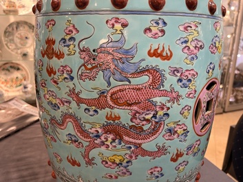 A pair of Chinese famille rose turquoise-ground 'dragon' garden seats, 20th C.