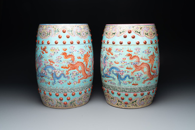 A pair of Chinese famille rose turquoise-ground 'dragon' garden seats, 20th C.