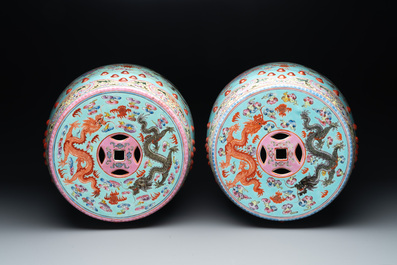 A pair of Chinese famille rose turquoise-ground 'dragon' garden seats, 20th C.