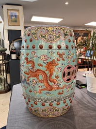 A pair of Chinese famille rose turquoise-ground 'dragon' garden seats, 20th C.