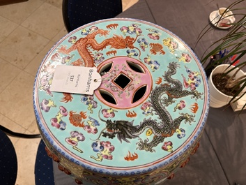 A pair of Chinese famille rose turquoise-ground 'dragon' garden seats, 20th C.