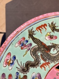 A pair of Chinese famille rose turquoise-ground 'dragon' garden seats, 20th C.