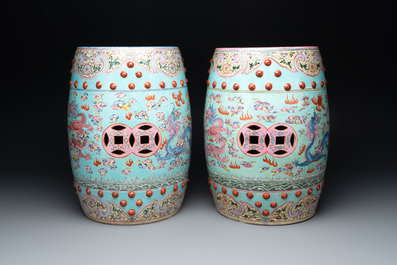 A pair of Chinese famille rose turquoise-ground 'dragon' garden seats, 20th C.