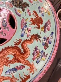 A pair of Chinese famille rose turquoise-ground 'dragon' garden seats, 20th C.