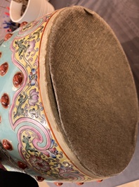 A pair of Chinese famille rose turquoise-ground 'dragon' garden seats, 20th C.