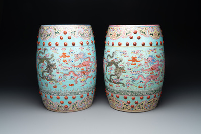 A pair of Chinese famille rose turquoise-ground 'dragon' garden seats, 20th C.