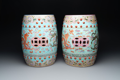 A pair of Chinese famille rose turquoise-ground 'dragon' garden seats, 20th C.