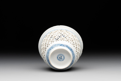 A Chinese blue and white reticulated double-walled cup and saucer, fu mark, Kangxi