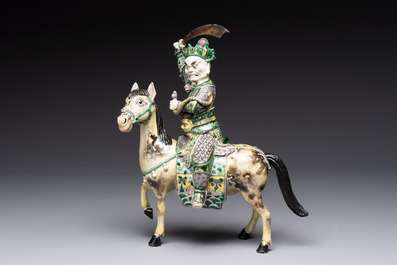A fine Chinese verte biscuit sculpture of a Heavenly King on horseback, 19th C.