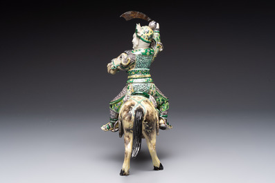 A fine Chinese verte biscuit sculpture of a Heavenly King on horseback, 19th C.