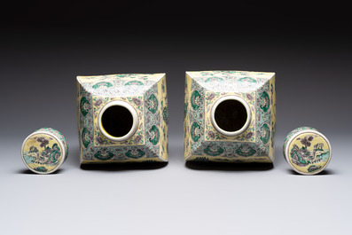 A pair of Chinese verte biscuit covered square jars on wooden stand, 19th C.