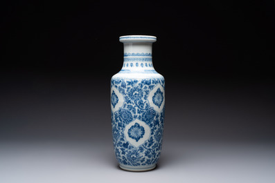 A Chinese blue and white 'flower scrolls' rouleau vase, Kangxi