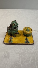 A pair of Chinese sancai-glazed Buddhist lions and an inkwell, 19th C.