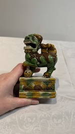 A pair of Chinese sancai-glazed Buddhist lions and an inkwell, 19th C.