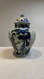 A Chinese wucai vase and cover with court ladies and playing boys, Transitional period