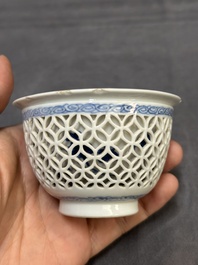 A Chinese blue and white reticulated double-walled cup and saucer, fu mark, Kangxi