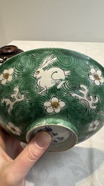 A Chinese verte biscuit 'animals among waves' bowl and a wooden stand, Jiajing mark, Kangxi