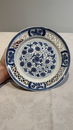 Two Chinese blue and white 'reticulated border' plates, Kangxi