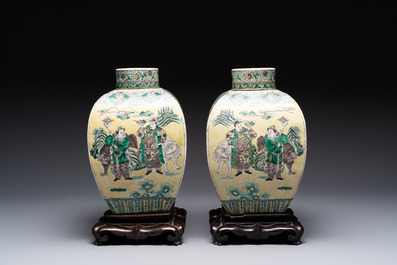 A pair of Chinese verte biscuit covered square jars on wooden stand, 19th C.