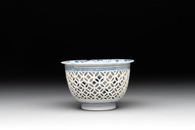A Chinese blue and white reticulated double-walled cup and saucer, fu mark, Kangxi