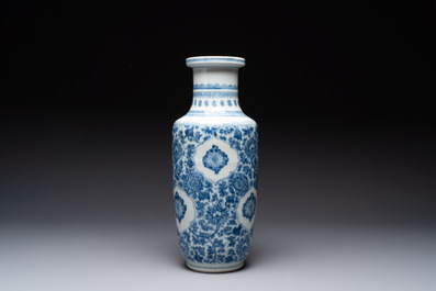 A Chinese blue and white 'flower scrolls' rouleau vase, Kangxi