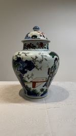 A Chinese wucai vase and cover with court ladies and playing boys, Transitional period