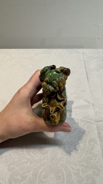 A pair of Chinese sancai-glazed Buddhist lions and an inkwell, 19th C.