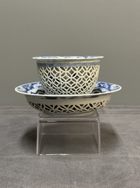 A Chinese blue and white reticulated double-walled cup and saucer, fu mark, Kangxi