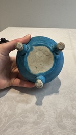 A Chinese turquoise-glazed tripod censer with wooden cover, Ming