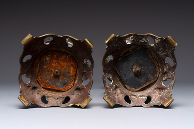 A pair of Chinese blue and white bronze-mounted vases and a covered jar, 19th C.