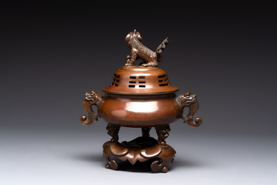 A Chinese bronze tripod censer with cover and stand, a small tripod censer and a silver-inlaid iron brush pot, 19/20th C.
