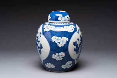 A pair of Chinese blue and white bronze-mounted vases and a covered jar, 19th C.