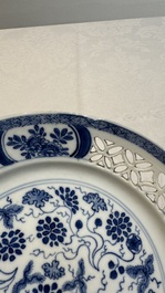Two Chinese blue and white 'reticulated border' plates, Kangxi
