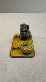 A pair of Chinese sancai-glazed Buddhist lions and an inkwell, 19th C.