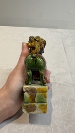 A pair of Chinese sancai-glazed Buddhist lions and an inkwell, 19th C.
