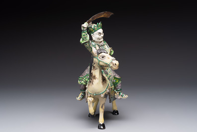 A fine Chinese verte biscuit sculpture of a Heavenly King on horseback, 19th C.