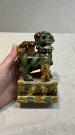 A pair of Chinese sancai-glazed Buddhist lions and an inkwell, 19th C.