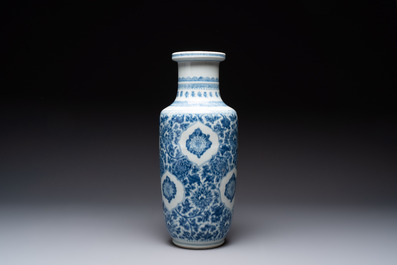 A Chinese blue and white 'flower scrolls' rouleau vase, Kangxi